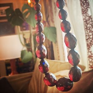 Vintage Cherry amber faceted Bakelite beads with sterling clasp.